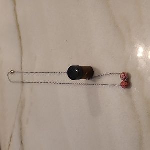 Essential oils necklace and bottle